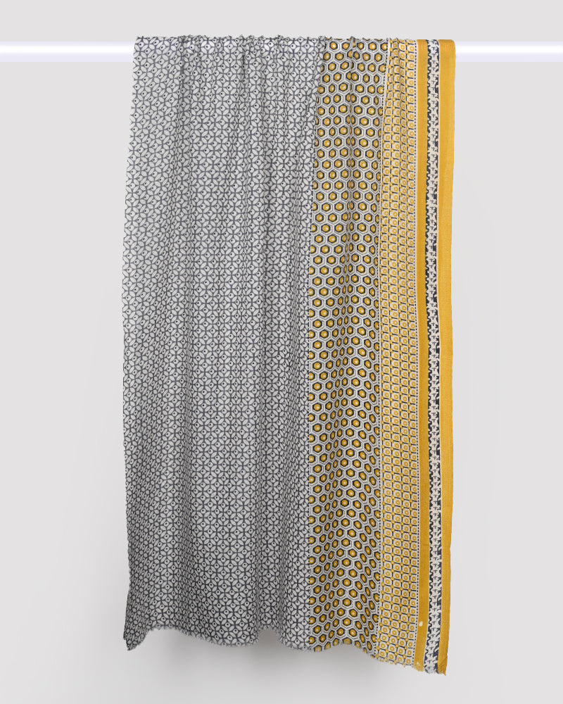 Textile with geometric pattern and yellow stripe