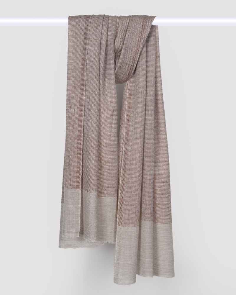 A beige pashmina wool natural border stole for office wear.

